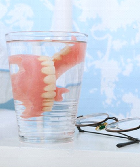Dentures in Vero Beach in a glass of water