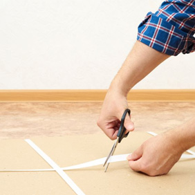 Person using scissors to open a package