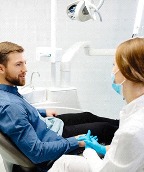 Dentist and patient engaged in conversation