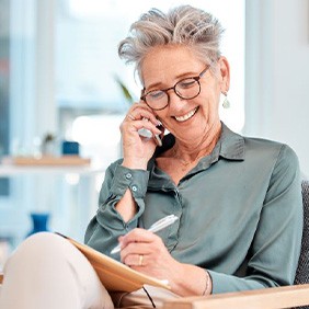 Happy older woman talking on phone