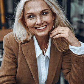 Mature professional woman sitting at café table