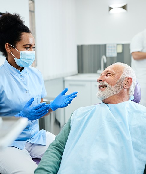 Patient speaking with dental team member