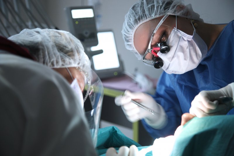 Dentists performing surgery